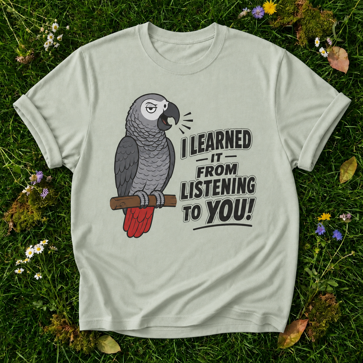 I Learned It From Listening to You Parrot T-Shirt in Bay on grass