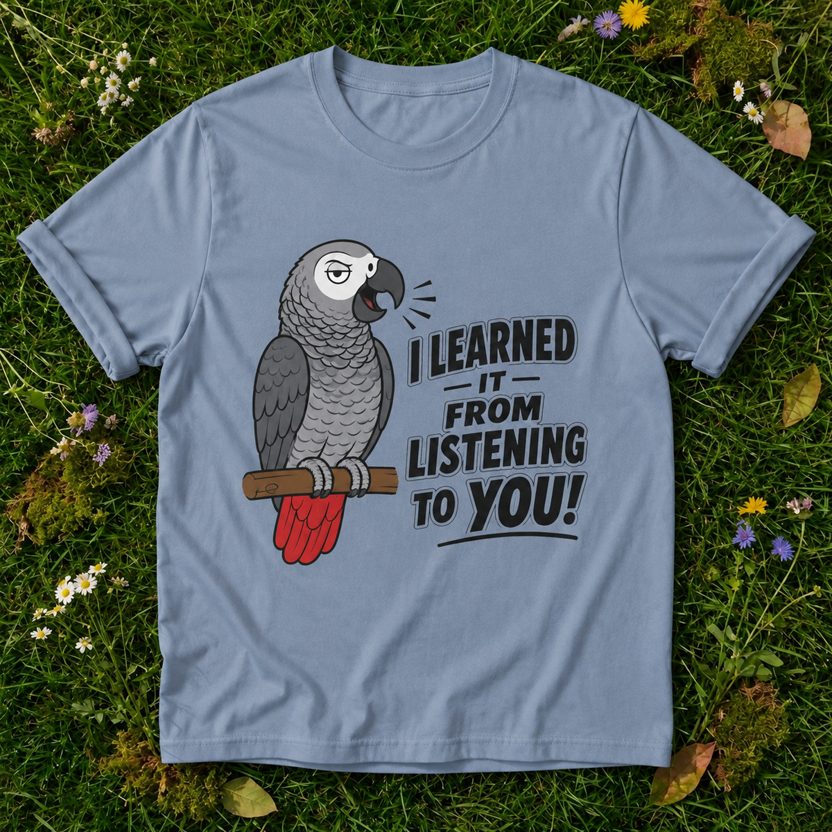 I Learned It From Listening to You Parrot T-Shirt in Blue Jean on grass
