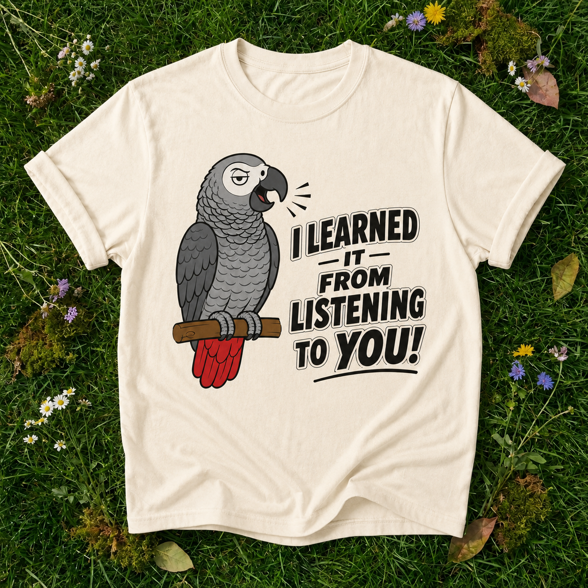 I Learned It From Listening to You Parrot T-Shirt in Ivory on grass